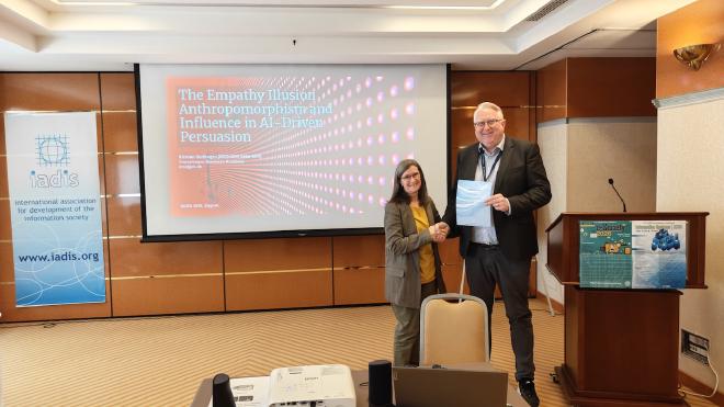 Kristian Stoffregen receiving his diploma for presenting at the 19th IADIS International Conference Information Systems 2026