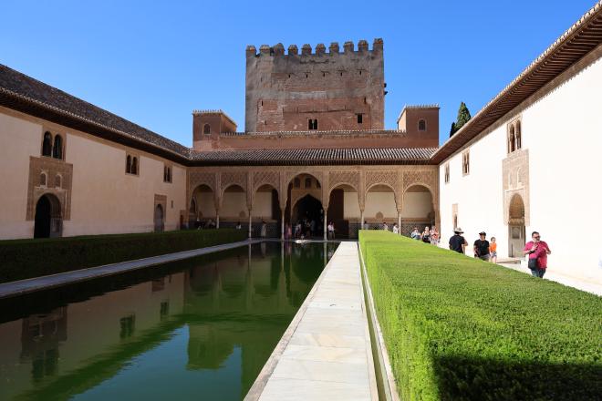 The Court of the Myrtles inside the Alhambra, with the long reflecting pool and the Tower of Comares at the far end.