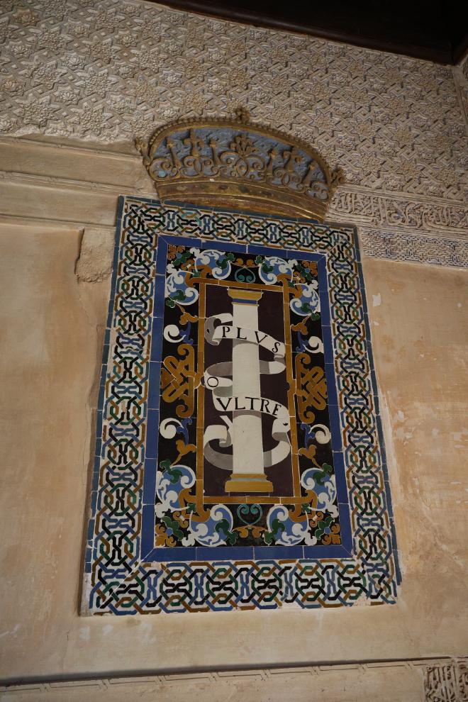 A glazed tile panel inside the Alhambra showing the Plus Ultra motto.